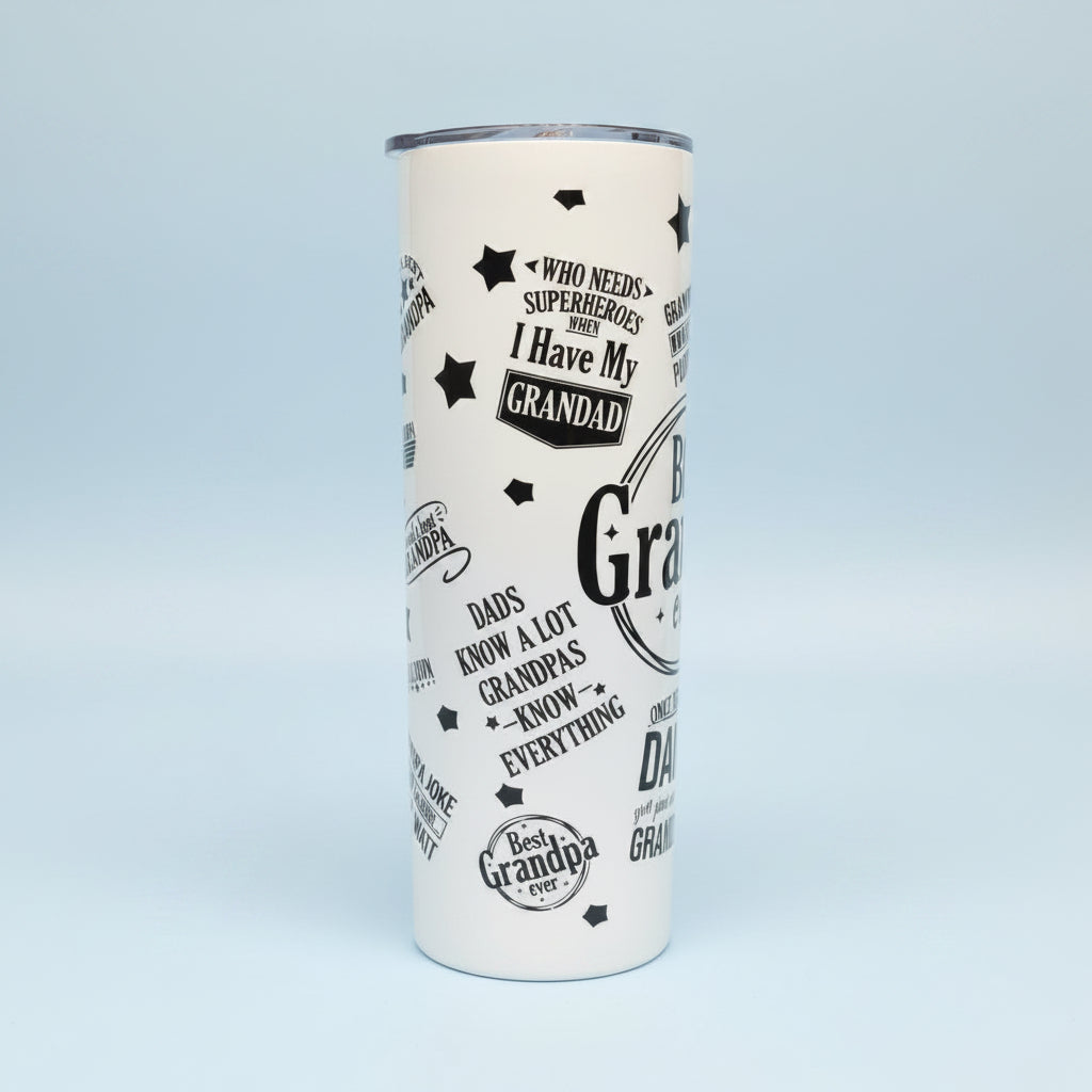 White tumbler with black text and graphics on a granite countertop.