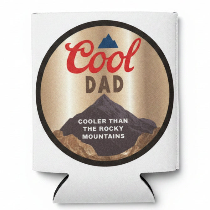Koozie with 'Cool Dad, Cooler than the Rocky Mountains' text in a clear package on a black background