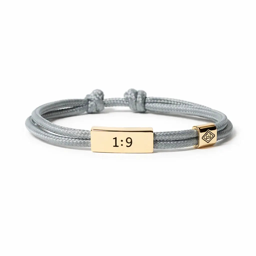 Gray braided bracelet with gold tag and number '1:9' on a white background