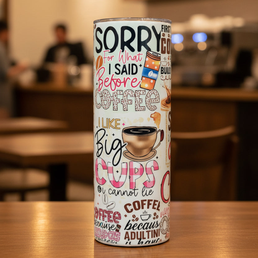 Tumblers with various designs, including a prominently displayed one with text about coffee.