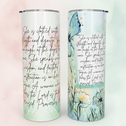 Two cylindrical tumblers with artistic designs and text on a dark surface.