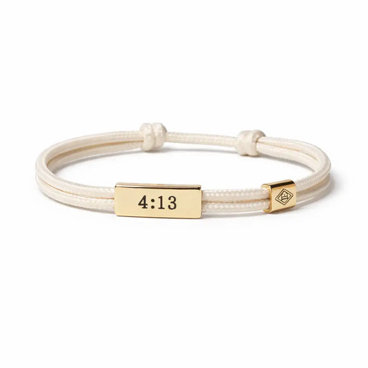Bracelet with gold tag displaying '4:13' on a white background