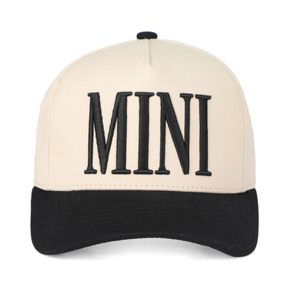 Beige and black cap with 'MINI' text on a white background