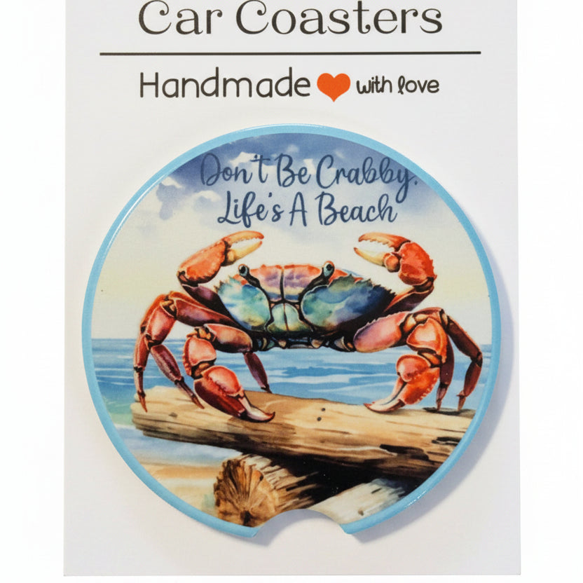 Car coaster with crab design and text on a dark background