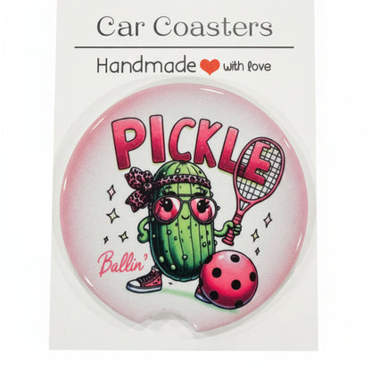 Car coaster with pickle design and 'Car Coasters' branding on a wooden surface