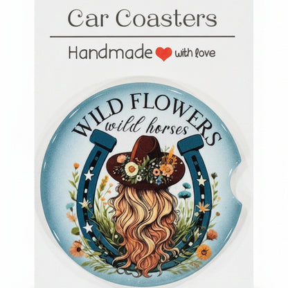 Decorative coaster with floral design and text on a white card, placed on a wooden surface.