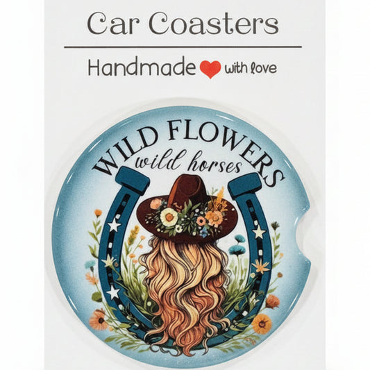 Decorative coaster with floral design and text on a white card, placed on a wooden surface.