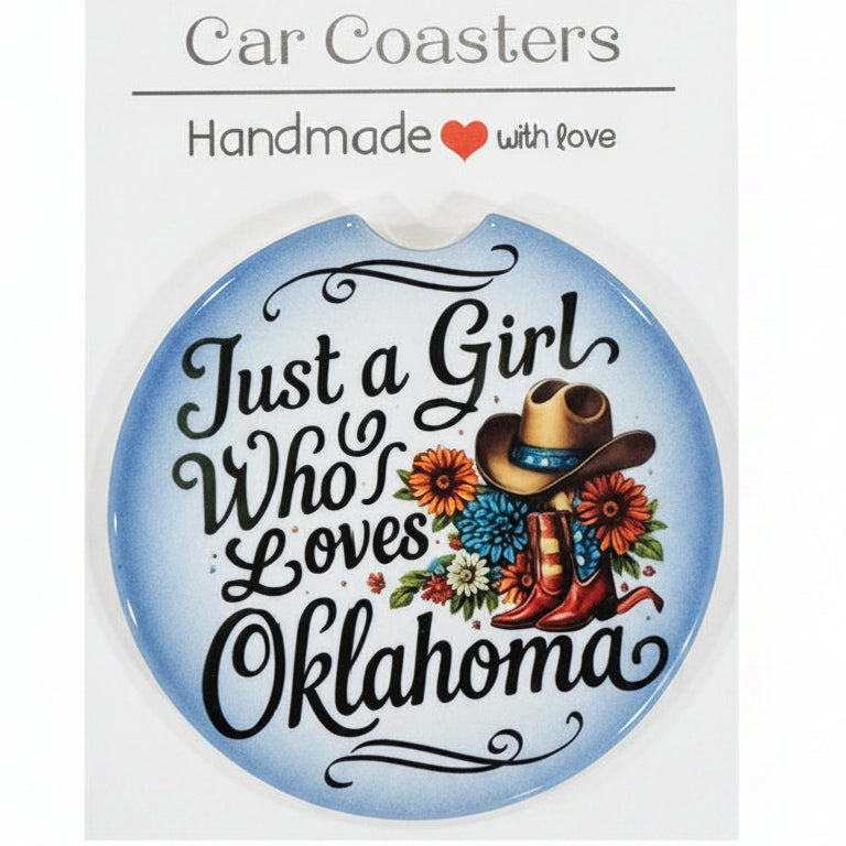 Car coaster with decorative text and floral design on a wooden surface