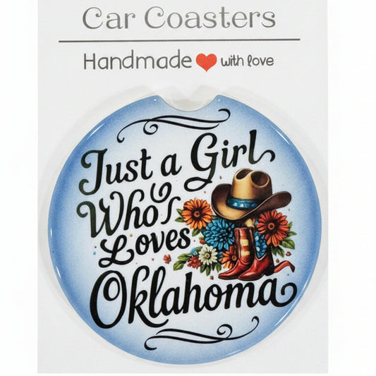 Car coaster with decorative text and floral design on a wooden surface