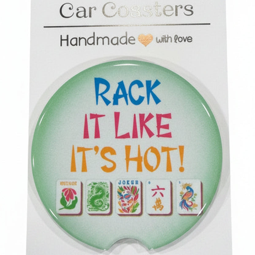 Round green coaster with text and graphics on a white card, placed on a wooden surface.