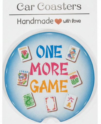 Car coaster with 'One More Game' text and card designs on a white backing card.