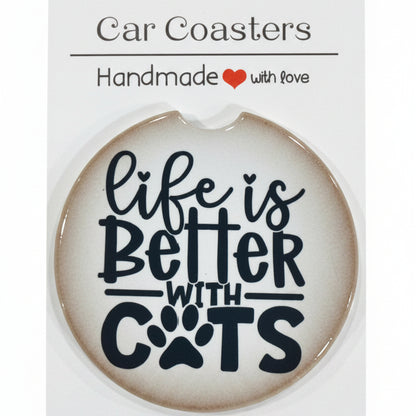 Car coaster with 'Life is better with cats' text on a white card, placed on a wooden surface.