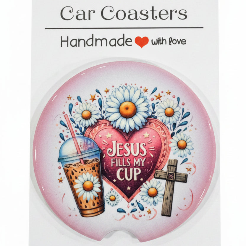 Car coaster with floral design and text on a wooden surface