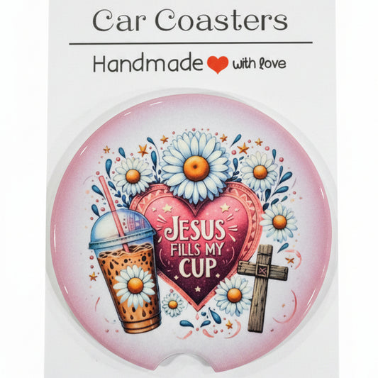 Car coaster with floral design and text on a wooden surface