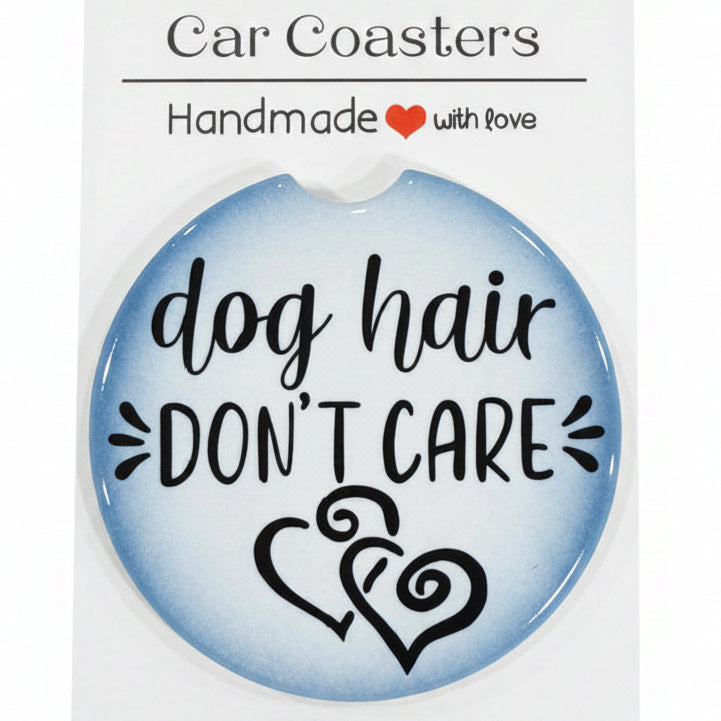 Car coaster with 'dog hair don't care' design on a wooden surface