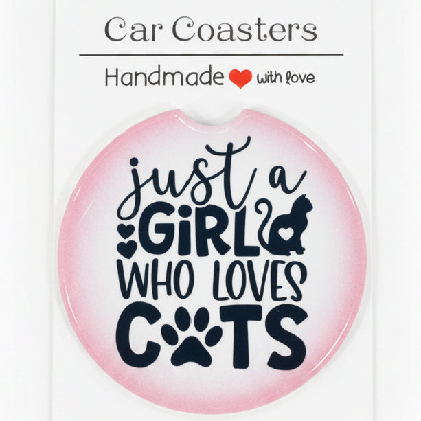 Car coaster with text 'Just a girl who loves cats' on a wooden surface
