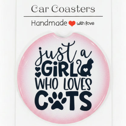 Car coaster with text 'Just a girl who loves cats' on a wooden surface