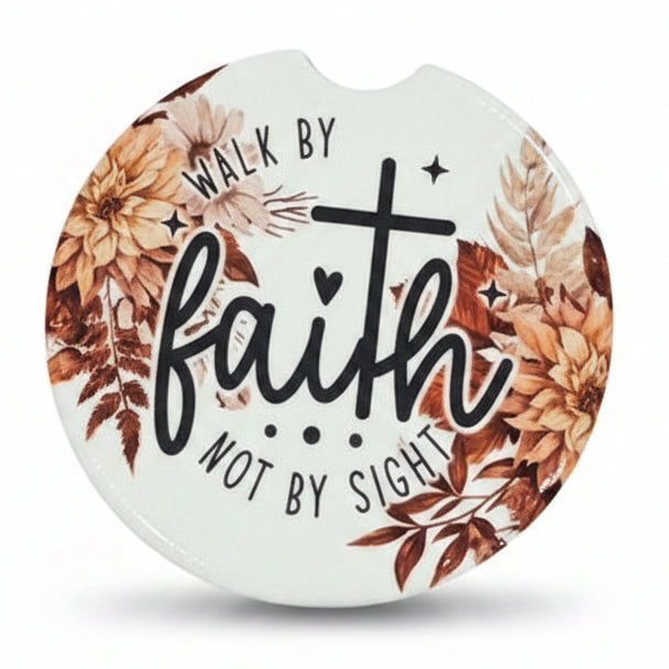 Set of three circular car coasters with motivational phrases and floral designs on a white background.
