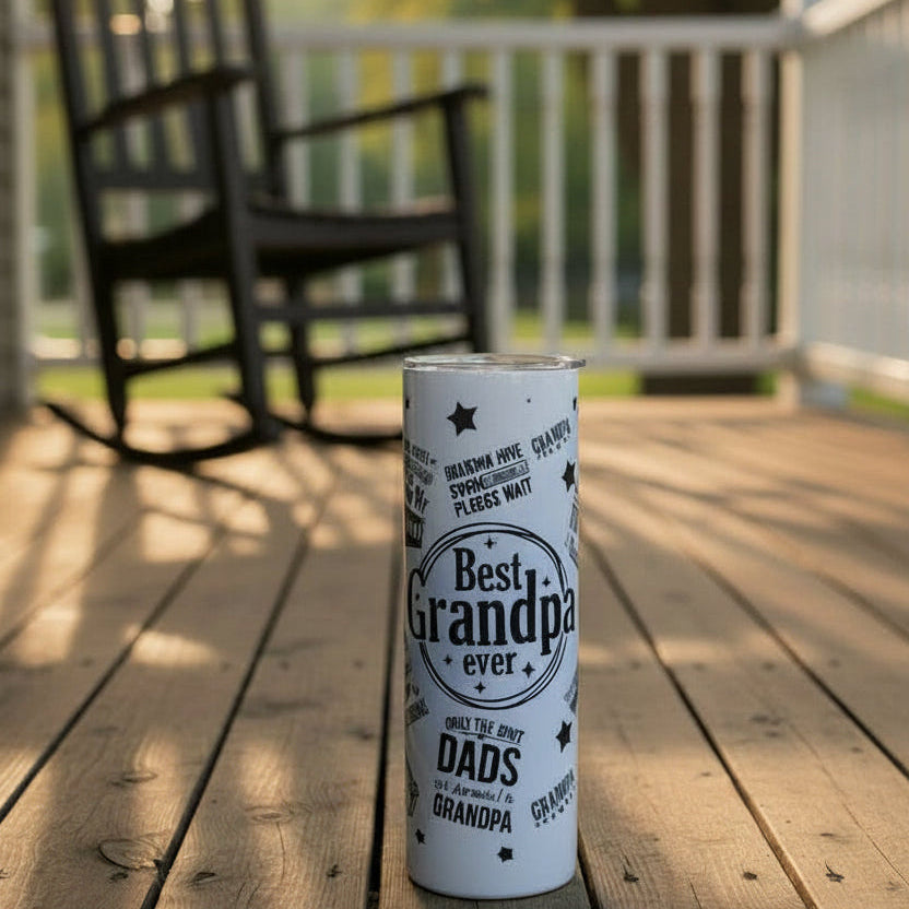 Tumbler with 'Best Grandpa Ever' text on a floor of the porch
