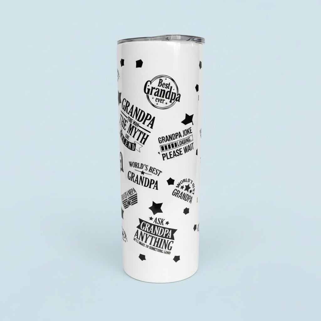 White tumbler with black text and designs on a granite countertop.
