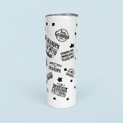 White tumbler with black text and designs on a granite countertop.