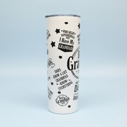 White tumbler with black text and graphics on a granite countertop.