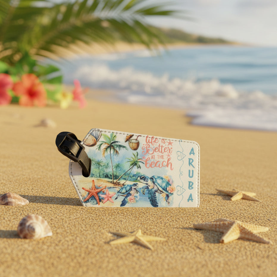 Luggage tag with beach-themed design featuring seashells, starfish, and floral elements on a white background.