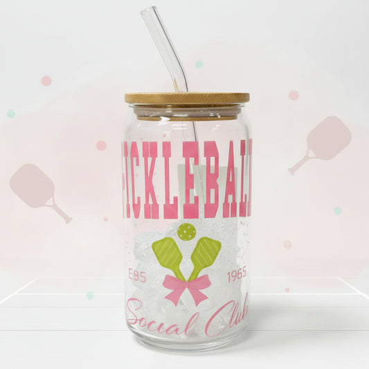 Tumbler with wooden lid and straw featuring a design and text on a white background